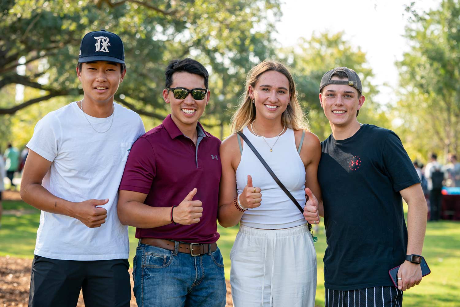ϲʹ̳ Students posing for a photo at Aggie Park